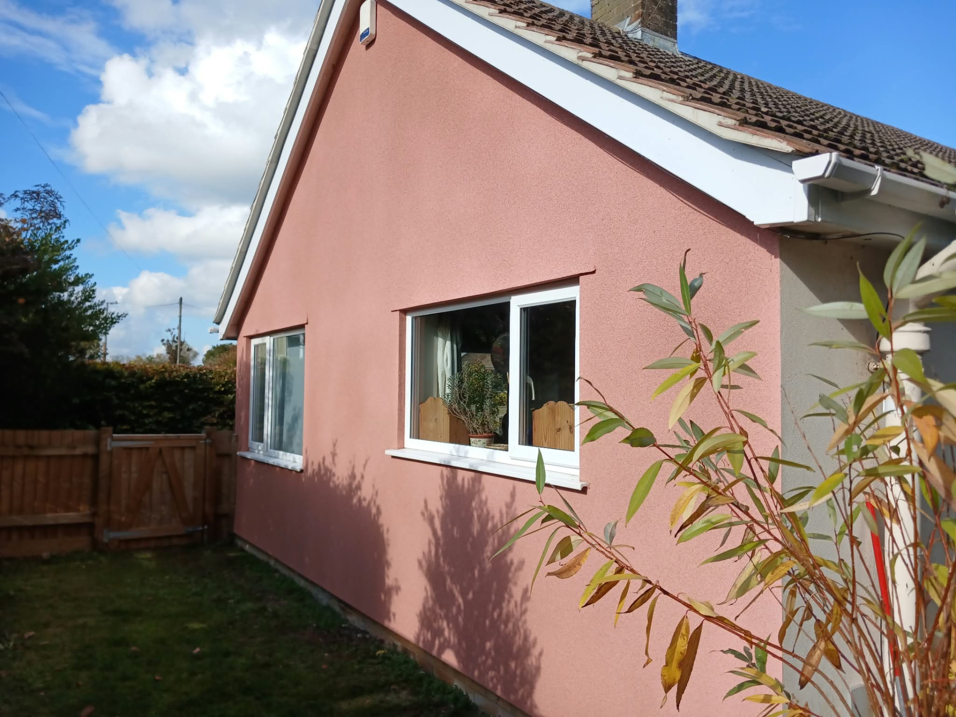 Completed DSB spray cork finish in Frome across the gable elevation and around both windows